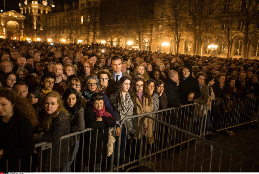 People gather outside of the Notre-Dame cathedral to attend a mass in Paris, France. (Photo: Xinhua/Xu Jinquan)