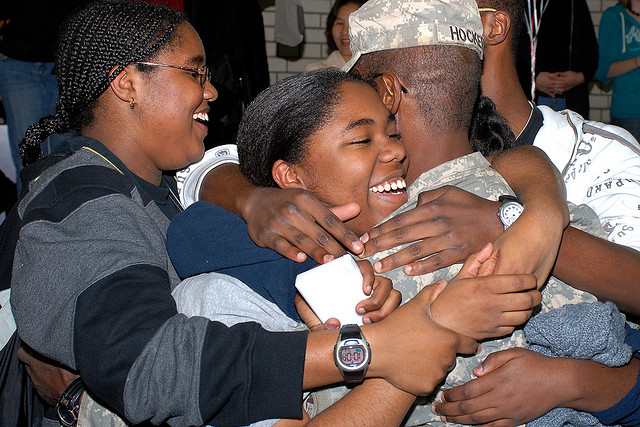Sgt. 1st Class Danny J. Hocker, is embraced by his family during a welcome home ceremony in Vilseck, Germany, Oct. 23, 2008. He returned to Germany after a 15-month deployment in support of Operation Iraqi Freedom. (Photo: US Army Photo by SPC Pastora Y. Hall/Released)