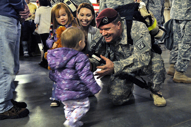 Staff Sgt. Michael Bernquist, holds his arms out for his daughter Evelyn, 1, after returning from a 12 month deployment to Iraq at Fort Bragg, N.C., Nov. 4, 2010. Bernquist was also greeted by his wife, Brandi, and older daughter Brooke, 4. (Photo: US Army Flickr)