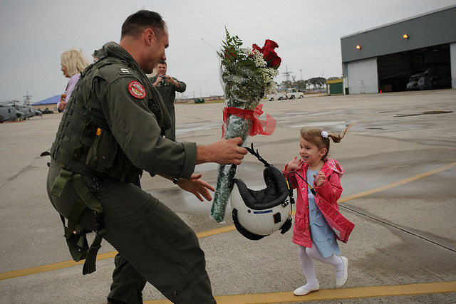 .S. Navy Lt. David Jarrett greets his daughter during a homecoming celebration at Naval Station Mayport, Fla., March 17, 2010. Jarrett is returned from a six-month deployment that supported counterpiracy operations in the Horn of Africa. (Photo: DoD photo by Mass Communication Specialist 2nd Class Gary B. Granger Jr., U.S. Navy/Released)