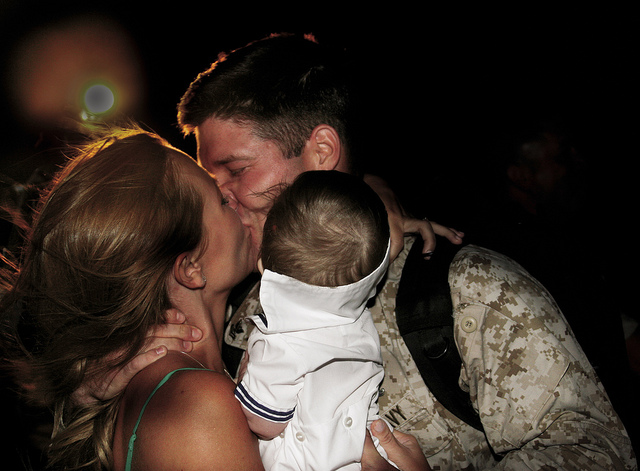 Navy Petty Officer Second Class Mitch T. Embry, corpsman, 1st Battalion, 3rd Marines, greets his wife after returning from a seven-month deployment to Afghanistan in support of Operation Enduring Freedom June 9, 2010. (Photo: United States Marine Corps Flickr)